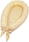 Babynest i økologisk bomuld - Müsli - Calm yellow - Print med små blomstergrene - 75x40 cm